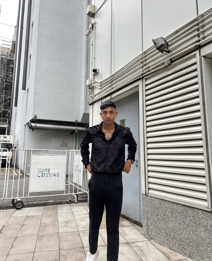 Arvin Walters standing outside in a black shirt in Singapore