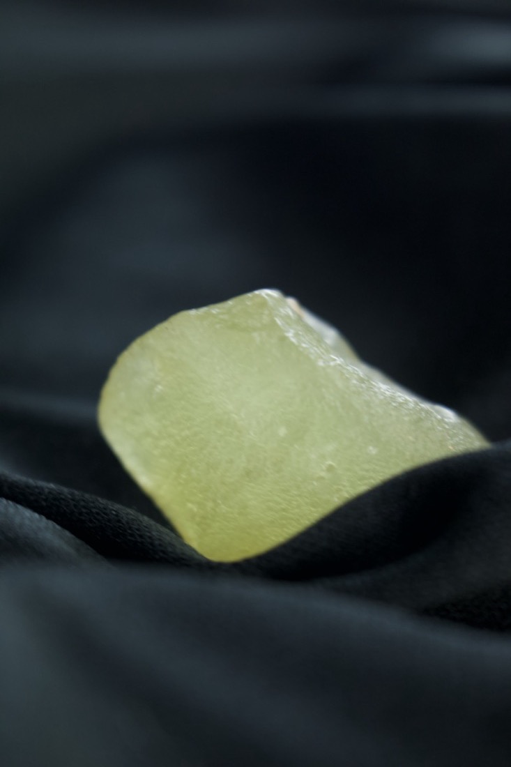 A smooth, rounded piece of Libyan Desert Glass