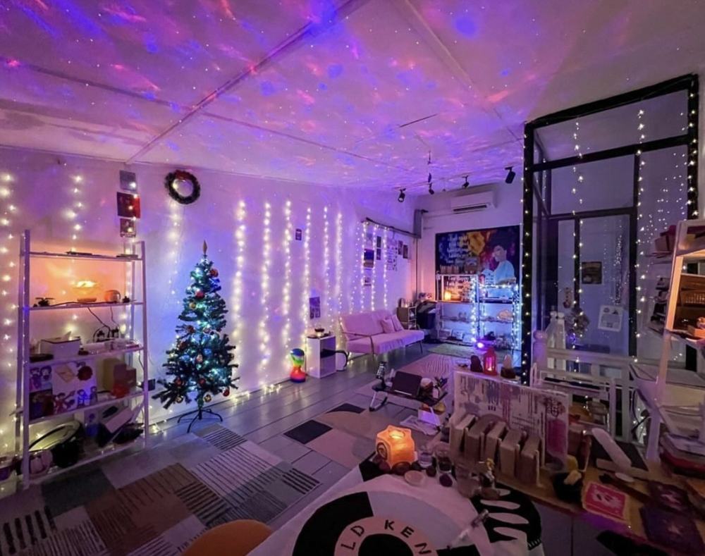 Interior of the 44A Haji Lane studio with fairy lights and a Christmas tree