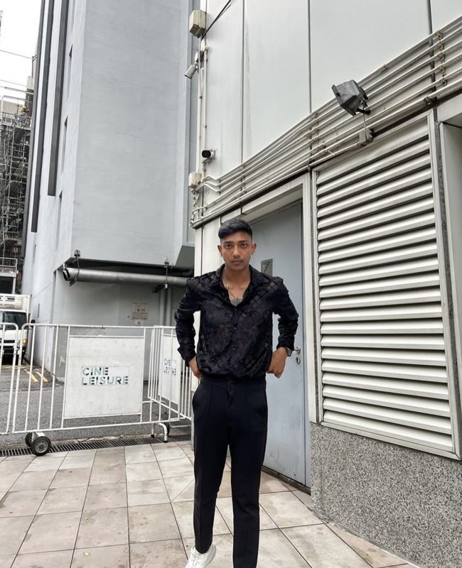 Arvin standing outside in a black shirt